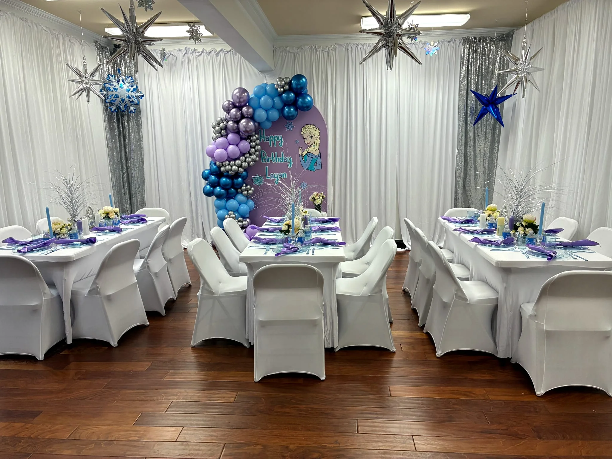 A themed children’s birthday celebration with a balloon arch and dressed tables at the Premier Planners venue
